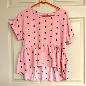 Pink peplum style top top with black polka dots
